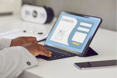 User filling out a clean, friction-free contact form on a tablet, representing conversion-focused web design and optimized inquiry forms for service-based businesses.